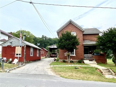 Front of home, driveway and detached garage