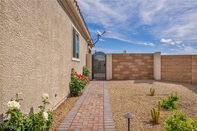 View of yard featuring fence and a gate