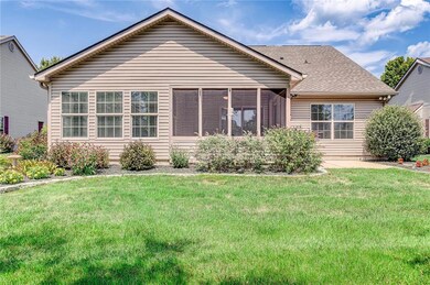 Rear elevation showing the screened porch and patio.