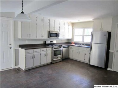 Another view of the kitchen showing door to garage