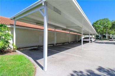 View of parking featuring a carport