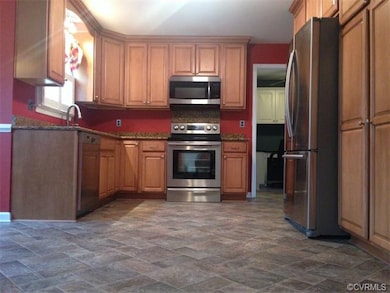 Kitchen with stainless steel appliances, pantry an