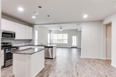 Kitchen with visible vents, stainless steel appli