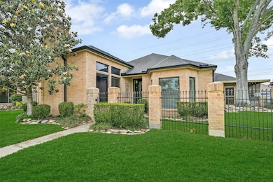 Beautifully maintained landscaping frames the home