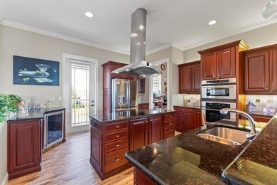 Stainless steel appliances, hood, and wine cooler