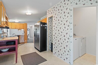 Kitchen featuring separate washer and dryer and st