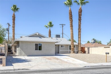 Ranch-style home featuring stucco siding, a gate,