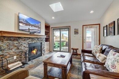 Living room featuring built in shelves, plenty of