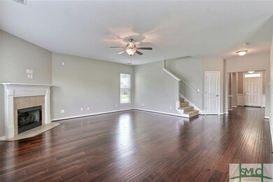 Living room with stairs to second floor