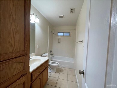 Full bath with vanity, tile patterned flooring, and bathing tub / shower combination