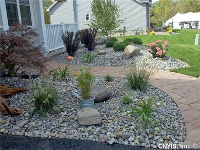 Exterior Front. River rock was the theme of our Pa
