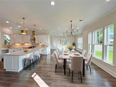 Dining room is virtually staged.