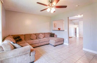 Welcome to the family den, a nice design conveniently opened to the kitchen while basking in the warm natural light from large windows!