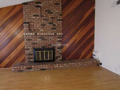 Living Room. wood burning fireplace with pine pane