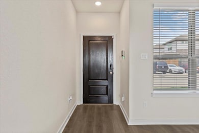 Foyer featuring dark wood-style floors