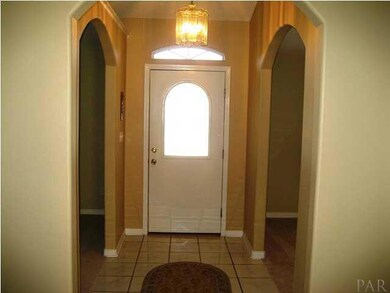 ENTRANCE FOYER- LIVING ROOM ON RIGHT AND DINING ROOM ON LEFT.