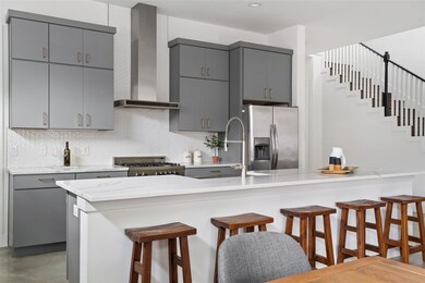 Kitchen with gray cabinets, a kitchen breakfast b