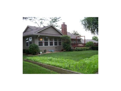 Back view.  Note the large deck, Masonry fireplace