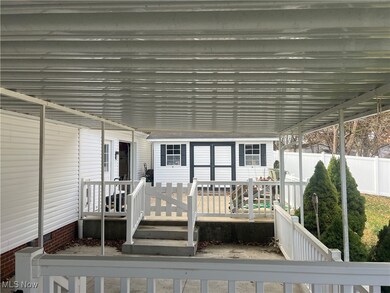 View deck with steps to adjoining deck.