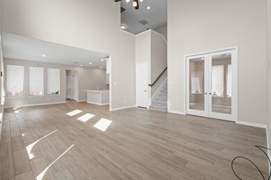 Unfurnished living room with light wood finished f