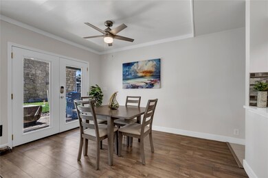 Dining space with a ceiling fan, french doors, wo