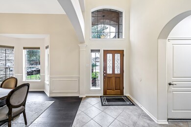 The front door is welcoming, with a formal dining