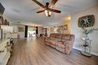 This spacious living area features wood-like floor