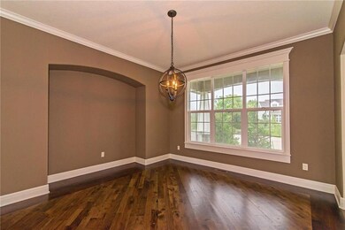 Through an expansive archway is the spacious forma