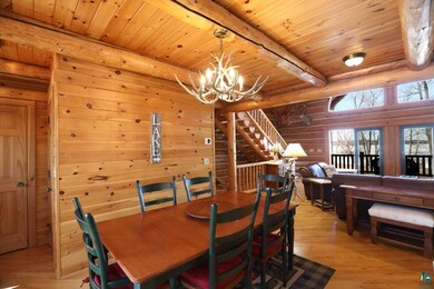 Dining room with a chandelier, light wood-style fl