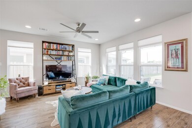 Living room featuring light wood-style floors, ce