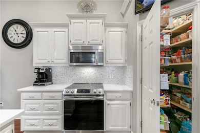 Stainless steel appliances and walk in pantry