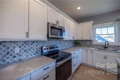 Beautiful Marble Countertops & Stainless Steel Appliances