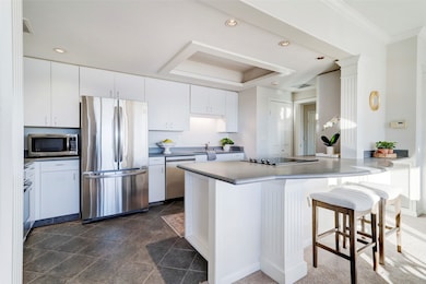Kitchen with recessed lighting, tile floors and br