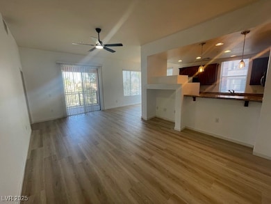 Unfurnished living room featuring ceiling fan, healthy amount of natural light, light wood finished floors, baseboards, and recessed lighting