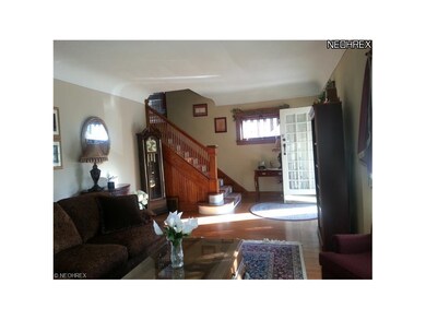 Stunning LR with ample space, wonderful hardwood, high ceilings (entire first floor) and a lovely staircase detail.