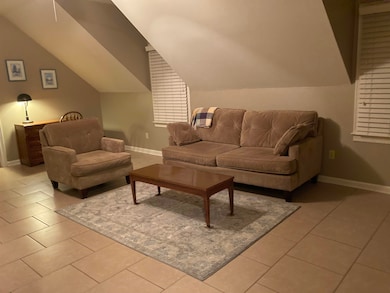 Couch, Sitting chair, coffee table, desk, TV with basic cable