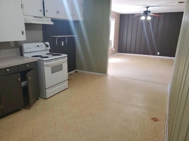 Kitchen with light countertops, under cabinet rang