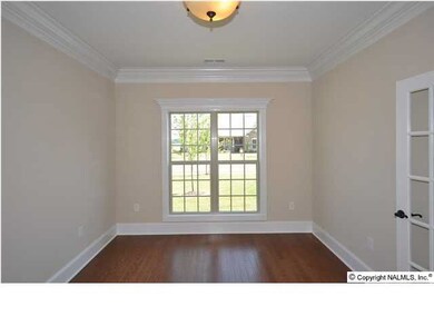 THE FORMAL LIVING AREA CAN ALSO SERVE AS THE PERFECT OFFICE OR STUDY