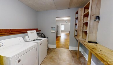 Back entrance into laundry and storage area