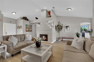 Living area featuring wine cooler, vaulted ceiling