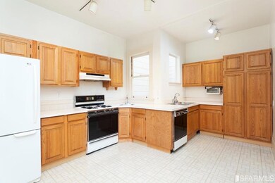 The eat kitchen is bright, having windows on three