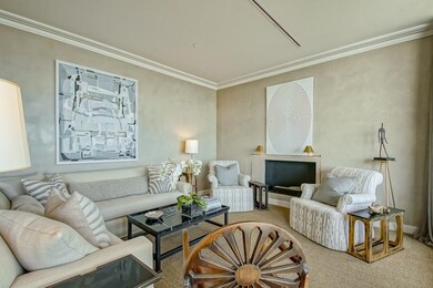 Living room w/ decorative fireplace, modern moldin