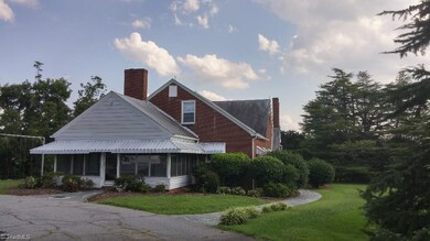 Jalousie windows on this large side porch.