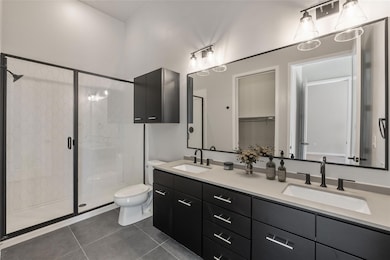 Bathroom featuring tile patterned floors, double 