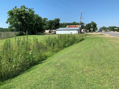 Road frontage looking from 4 way intersection.  Po