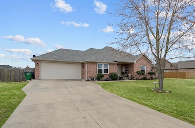 2 car garage with front entrance. Mature trees and landscaped.