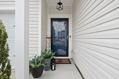 Doorway to property with a garage