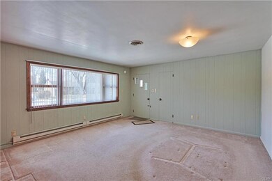 Enter into living room, highlighted by large repla