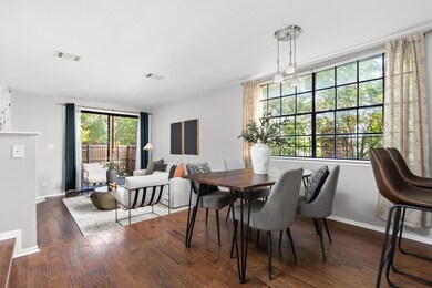 Dining area with baseboards and wood finished flo