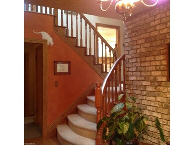 Beautifully finished oak railing leading to the Ki